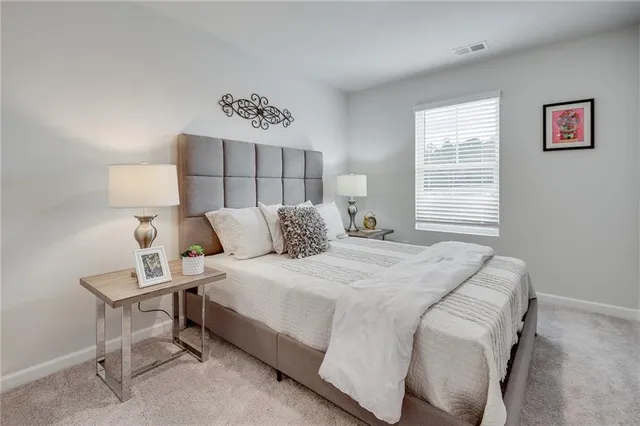 a bedroom with a bed and window