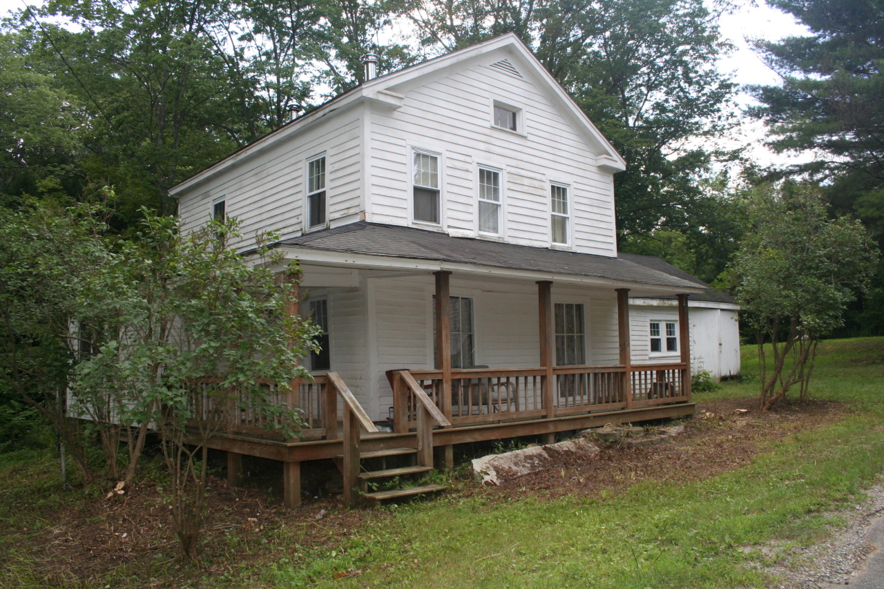 147 Sandisfield Road Sandisfield, MA 01255 - Photo 1 of 26 a front view of a house with a yard