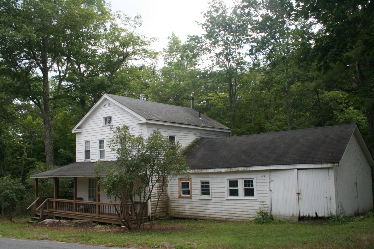 147 Sandisfield Road Sandisfield, MA 01255 - Photo 2 of 26 a front view of house with yard and green space