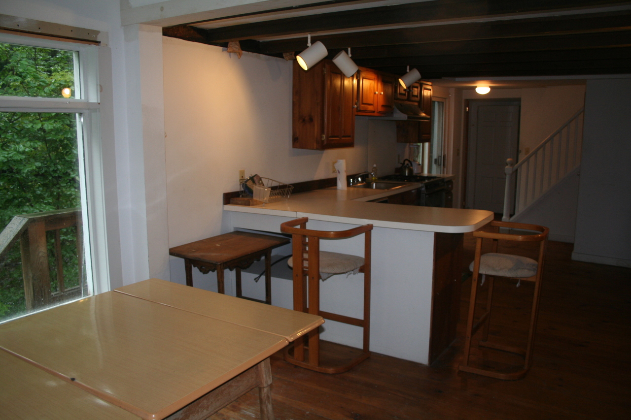 147 Sandisfield Road Sandisfield, MA 01255 - Photo 13 of 26 a room with chairs a table and chairs
