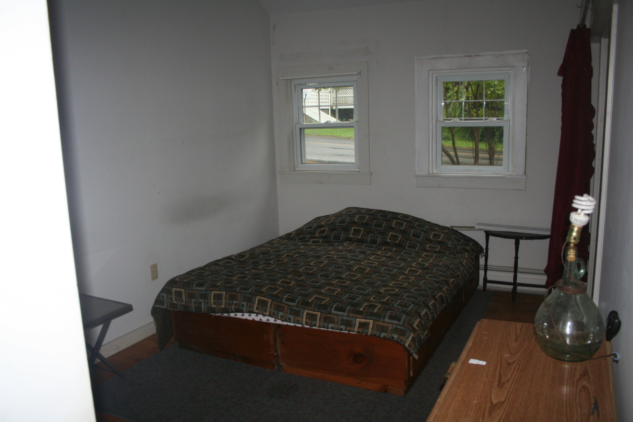 147 Sandisfield Road Sandisfield, MA 01255 - Photo 17 of 26 a bedroom with a bed and a window