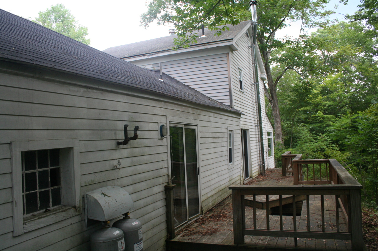 147 Sandisfield Road Sandisfield, MA 01255 - Photo 3 of 26 a view of house with a chairs in patio