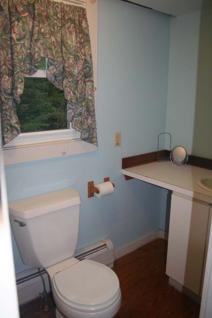 147 Sandisfield Road Sandisfield, MA 01255 - Photo 22 of 26 a white toilet sitting next to a bathroom sink