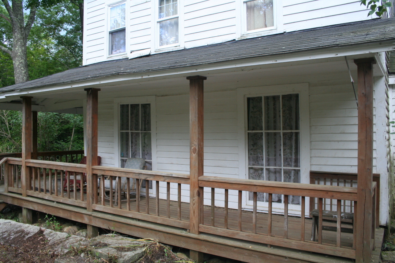 147 Sandisfield Road Sandisfield, MA 01255 - Photo 8 of 26 a view of a wooden house with a large window