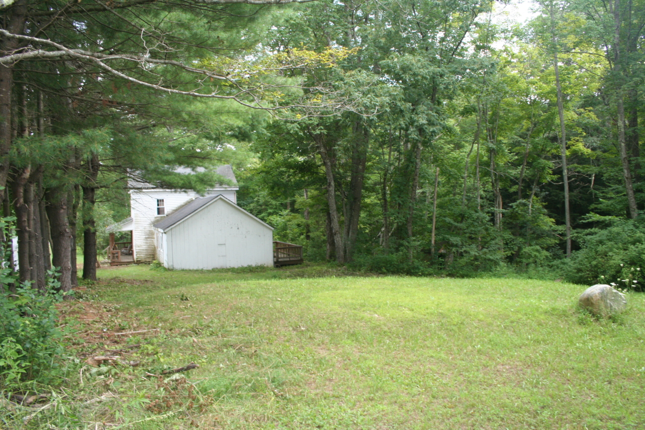 147 Sandisfield Road Sandisfield, MA 01255 - Photo 10 of 26 a house with a tree in front of it