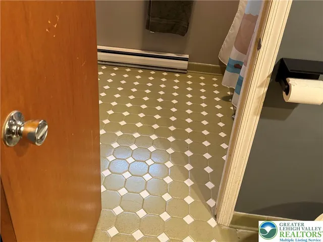 a bed room with a bed mirror and a desk