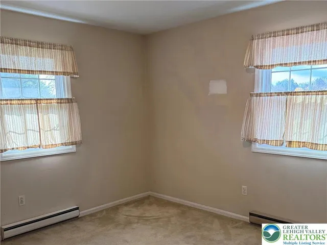 a view of a hallway with washer and dryer