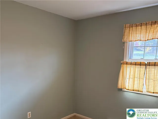 a backyard of a house with barbeque oven