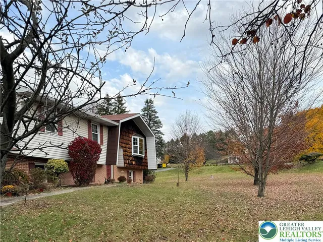 a view of staircase with wooden floor