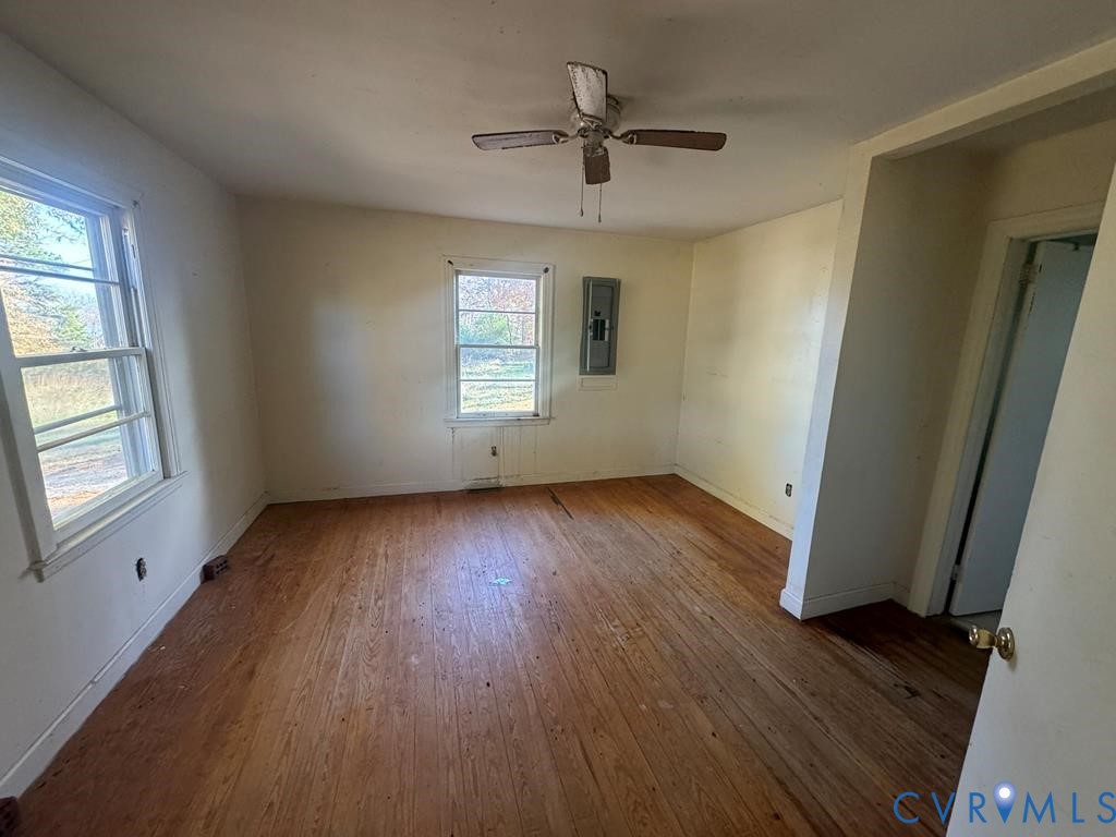 1045 Paul Pry Trail Halifax, VA 24558 - Photo 8 of 13 an empty room with wooden floor and windows