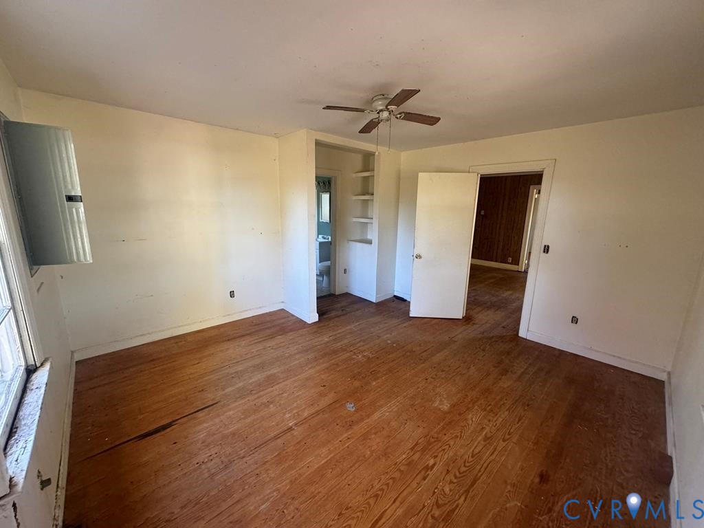 1045 Paul Pry Trail Halifax, VA 24558 - Photo 9 of 13 a view of empty room with wooden floor and fan