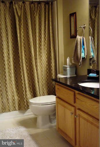 9137 Furey Road Lorton, VA 22079 - Photo 17 of 21 Full guest bath upstairs with granite countertop