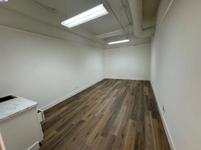 a view of wooden floor in an empty room