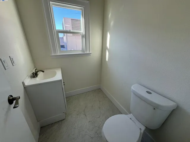 a bathroom with a toilet and a sink
