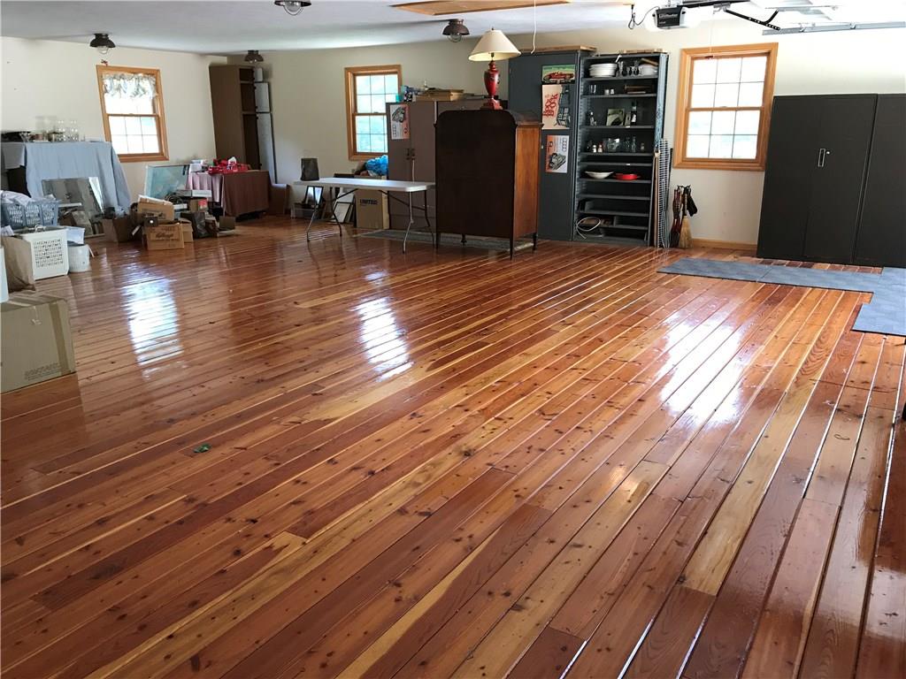 2092 Mercer Road New Brighton, PA 15066 - Photo 24 of 25 Enjoy entertaining in this finished space in the attached garage with pine flooring.