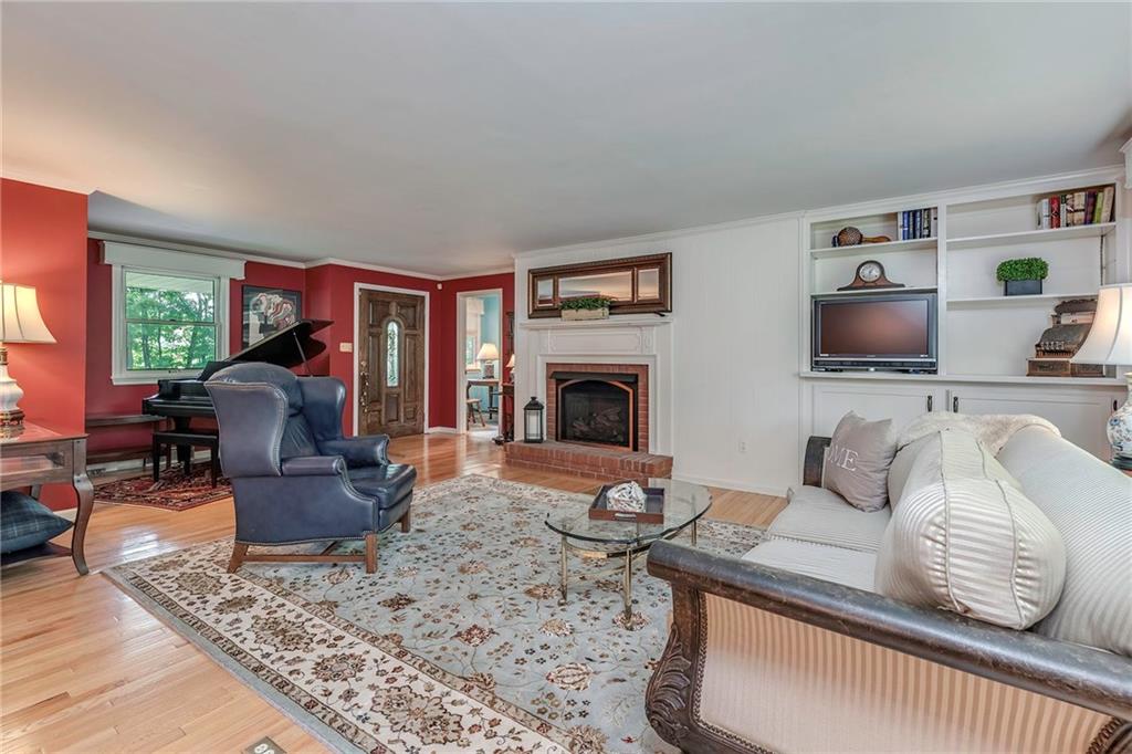 2092 Mercer Road New Brighton, PA 15066 - Photo 4 of 25 So much character in this home with the custom built-in shelves and three gas fireplaces.