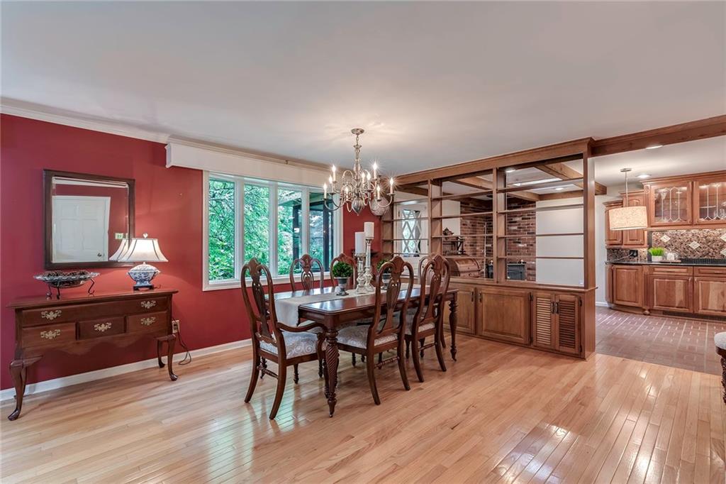 2092 Mercer Road New Brighton, PA 15066 - Photo 6 of 25 Crown molding and a large picture window help showcase this elegant dining area.