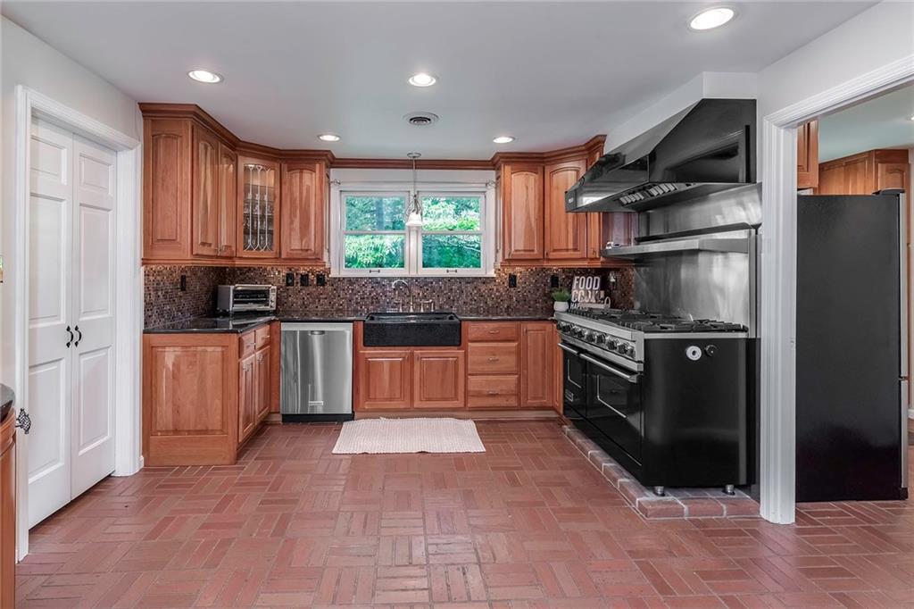 2092 Mercer Road New Brighton, PA 15066 - Photo 8 of 25 Welcome to this oversized gourmet kitchen equipped with a 48 inch Viking Stove making it every chef's dream. Complete with a farmhouse sink, recessed lighting and updated light fixtures.