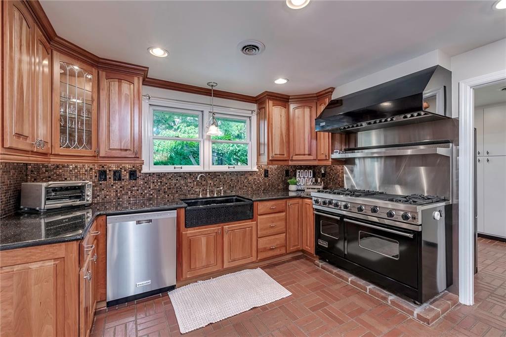 2092 Mercer Road New Brighton, PA 15066 - Photo 10 of 25 Granite countertops, stainless steel appliances and a Bizazza glass tile backsplash imported from Italy are just a few of the features in this gourmet kitchen.