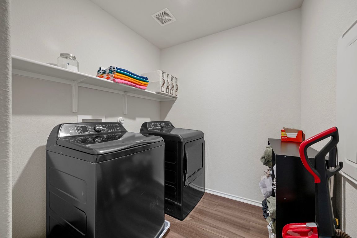 27 Pacific Loon Street Leander, TX 78641 - Photo 31 of 35 a utility room with dryer and washer
