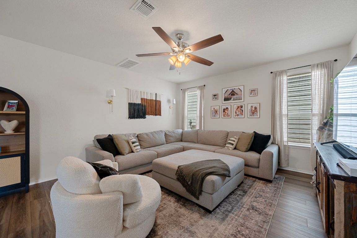 27 Pacific Loon Street Leander, TX 78641 - Photo 8 of 35 a bedroom with a bed couch and a window