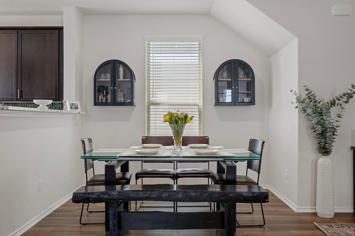 27 Pacific Loon Street Leander, TX 78641 - Photo 10 of 35 a dining room with furniture and wooden floor