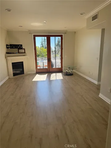 a view of a refrigerator with wooden floor