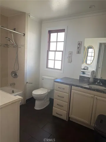 a living room with a bed and a window