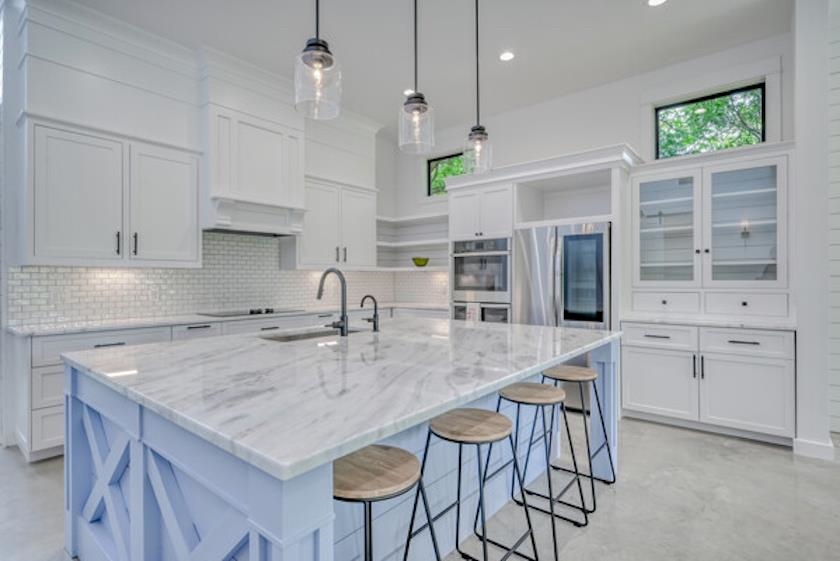 1018 River Road Burnet, TX 78611 - Photo 11 of 29 a kitchen with stainless steel appliances granite countertop a kitchen island a stove and a sink