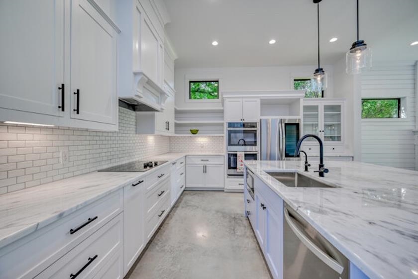 1018 River Road Burnet, TX 78611 - Photo 12 of 29 a large kitchen with stainless steel appliances lots of counter space sink and a stove