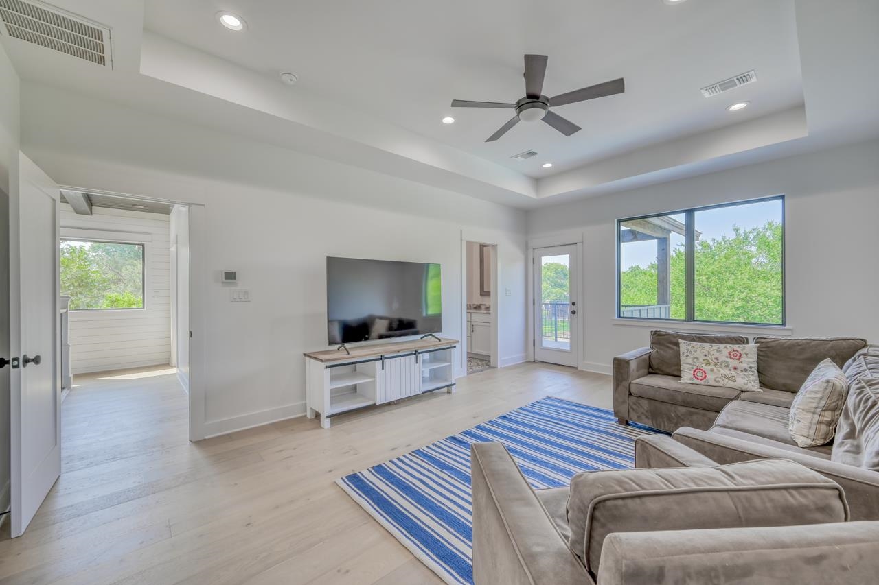 1018 River Road Burnet, TX 78611 - Photo 20 of 29 a living room with furniture and a flat screen tv