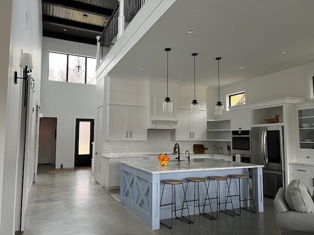 1018 River Road Burnet, TX 78611 - Photo 28 of 29 a kitchen that has a lot of cabinets in it and appliances