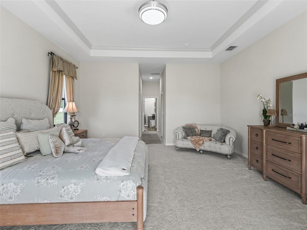 7041 Northeast 22nd Ct Road Ocala, FL 34479 - Photo 41 of 73 a bedroom with furniture and a couch