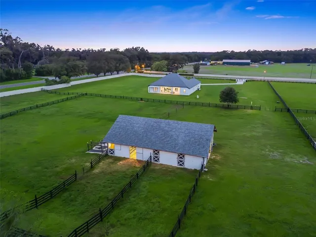 a room with lots of counter space and wooden floor