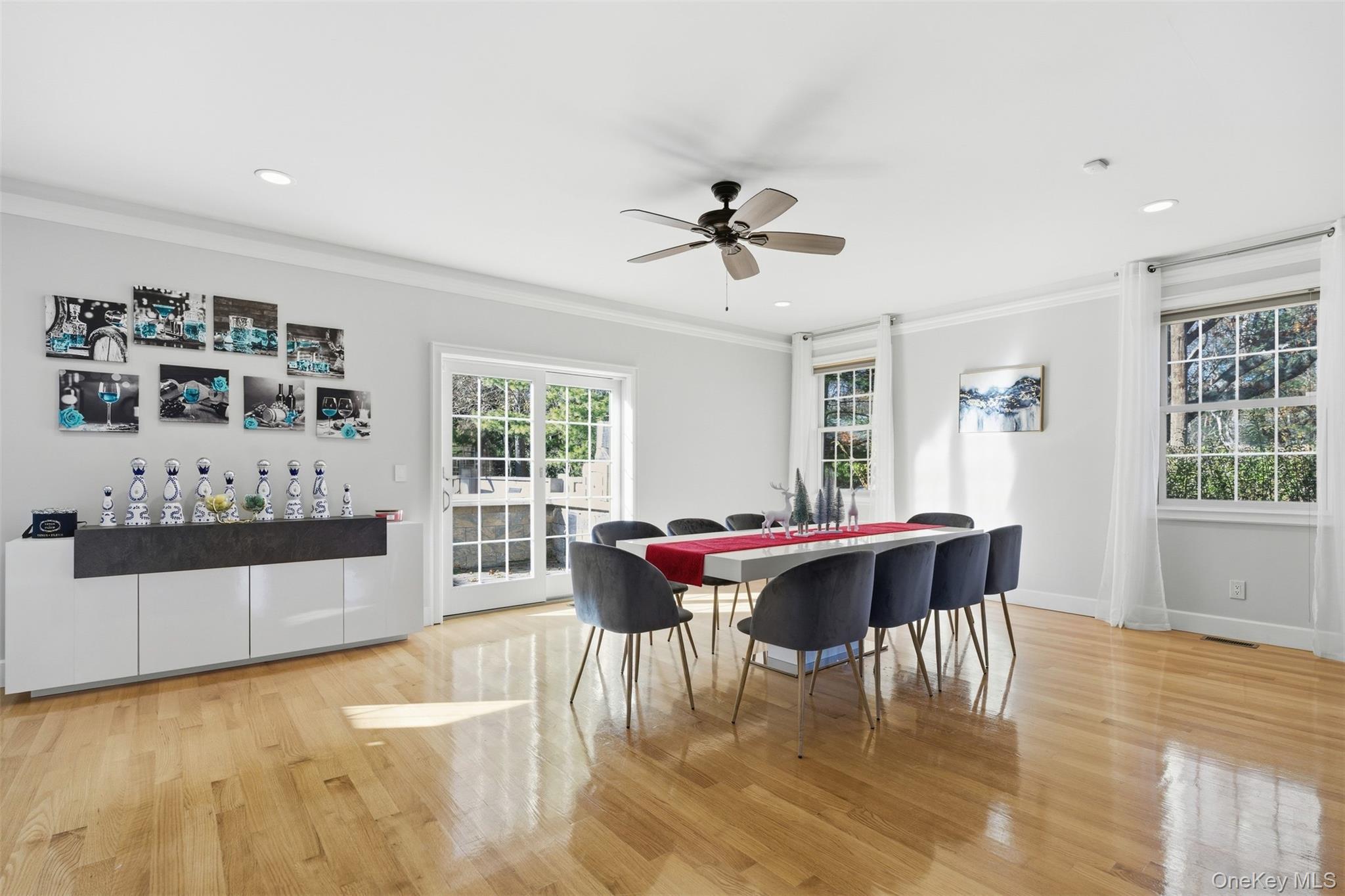 33 A Newtown Road Hampton Bays, NY 11946 - Photo 25 of 50 Dining space with ornamental molding, light wood-style floors, a ceiling fan, and recessed lighting