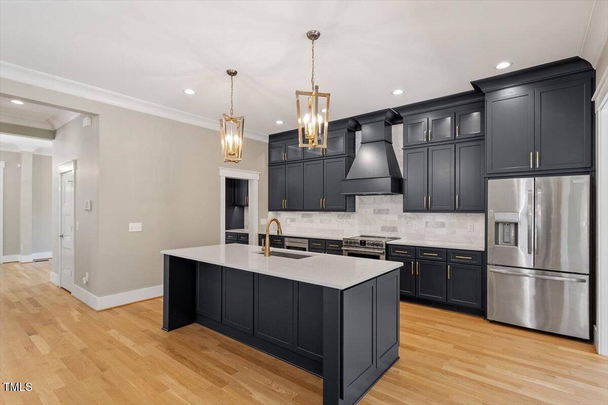 3934 Old Chapel Hill Road Durham, NC 27707 - Photo 20 of 47 a kitchen with stainless steel appliances granite countertop a sink stove and refrigerator