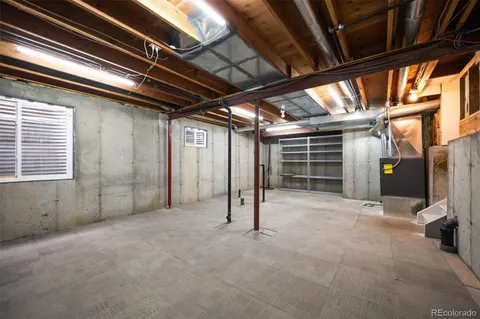 a view of empty room with wooden ceiling