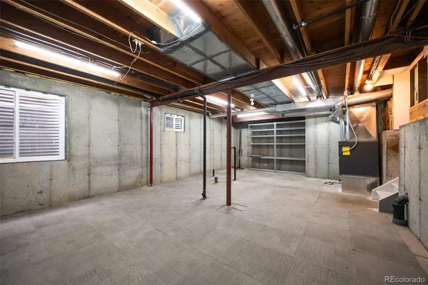a view of empty room with wooden ceiling