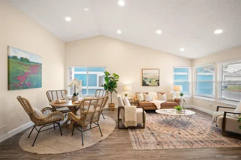 a living room with furniture and a table