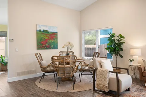 a view of a dining room with furniture window and wooden floor