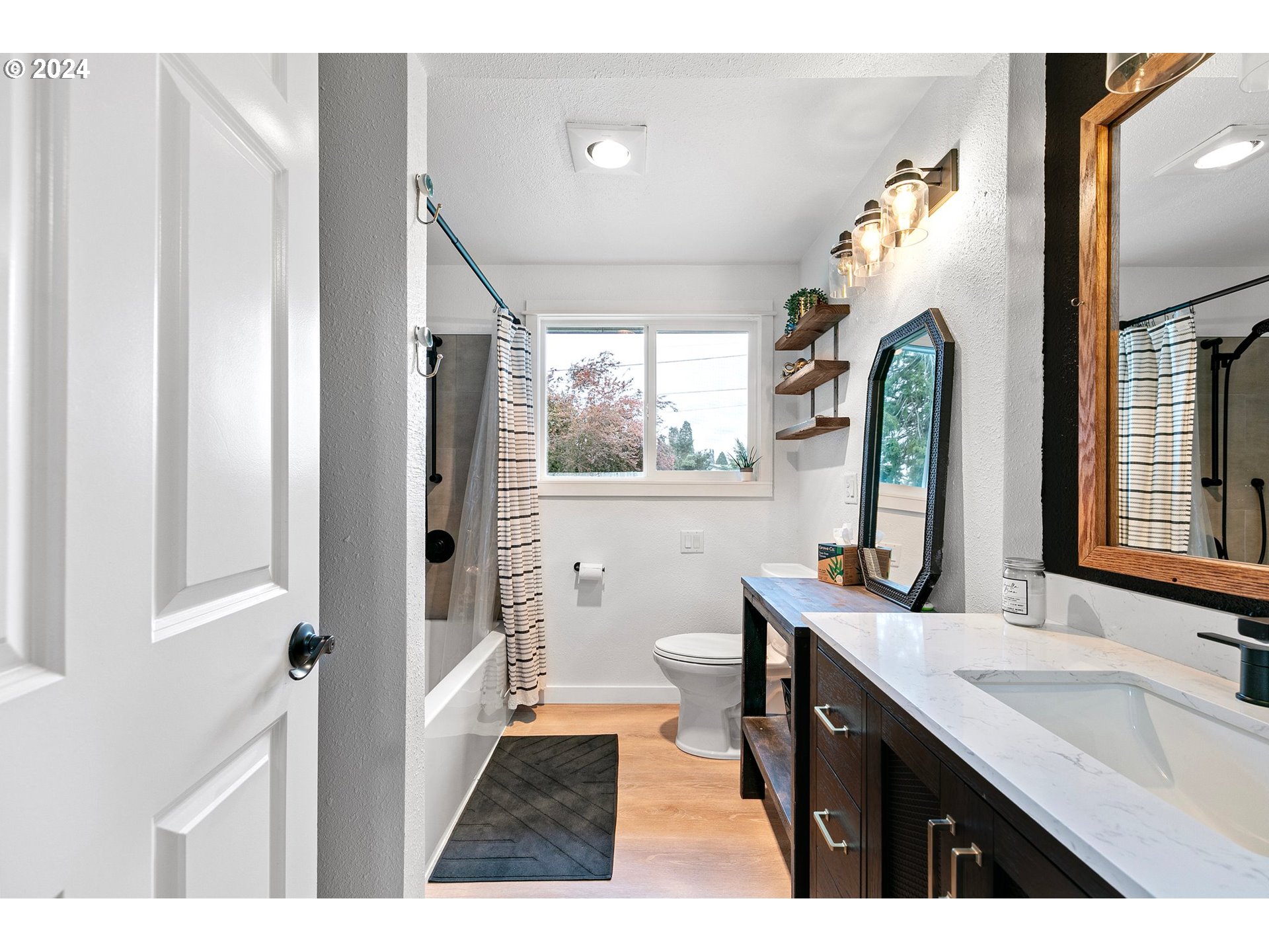 3734 Cherokee Drive Springfield, OR 97478 - Photo 20 of 39 a bathroom with a double vanity sink toilet and mirror