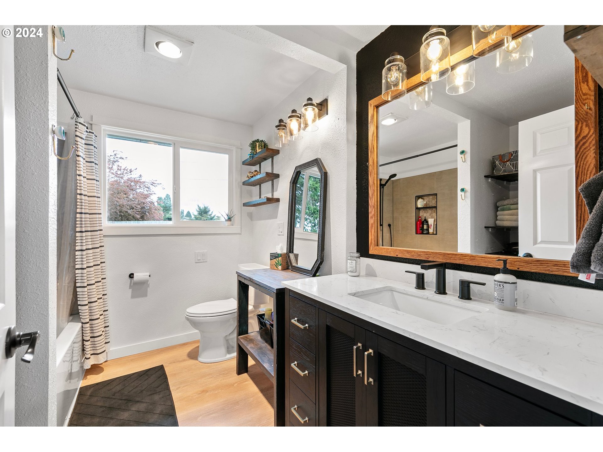 3734 Cherokee Drive Springfield, OR 97478 - Photo 21 of 39 a bathroom with a double vanity sink toilet and a mirror