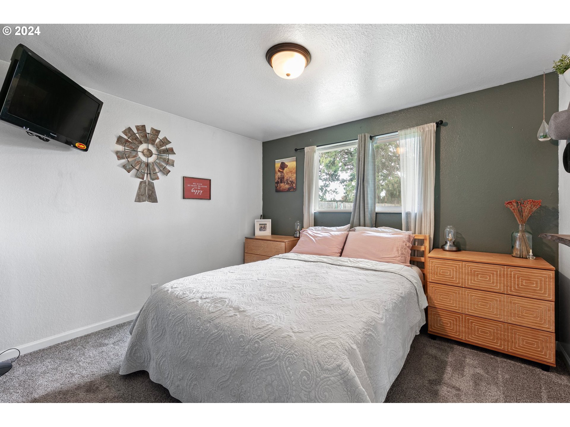 3734 Cherokee Drive Springfield, OR 97478 - Photo 29 of 39 a bedroom with a bed and a flat screen tv