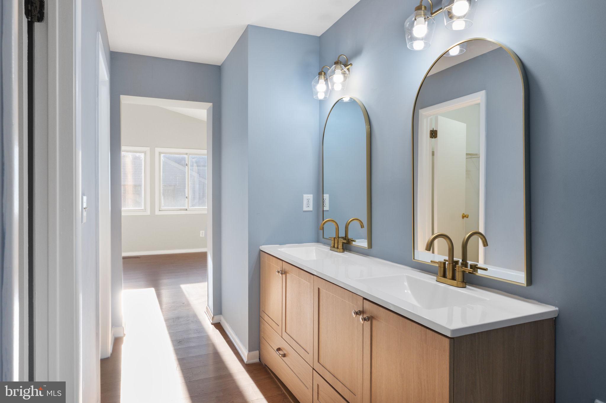 205 Michelle Court Newark, DE 19711 - Photo 28 of 37 a bathroom with a double vanity sink and a mirror