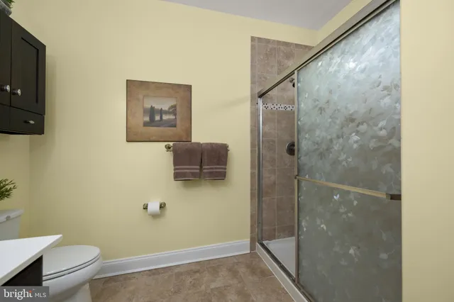 a bedroom with a large bed and a large window