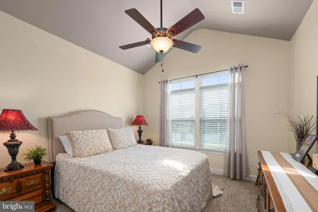 a bathroom with a sink a toilet and shower curtain