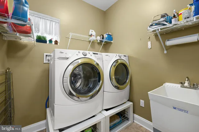 a view of a patio with couches table and chairs and potted plants