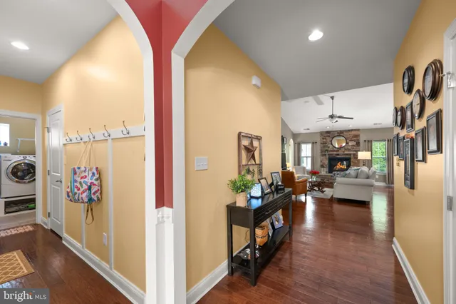 a living room with furniture fireplace and window