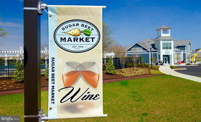 a white bed sitting in a bedroom next to a window