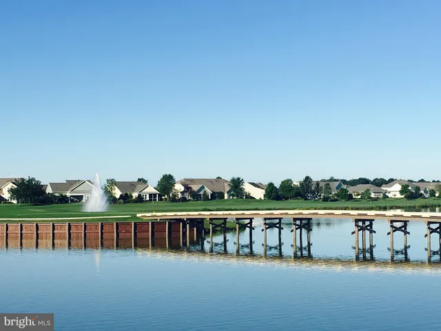 a view of a lake with a yard